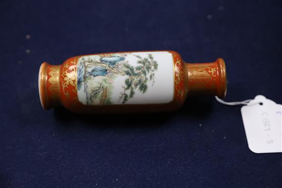 A Chinese coral ground famille rose cylindrical vase, Qianlong mark, Republic period, H. 15cm excluding wood stand